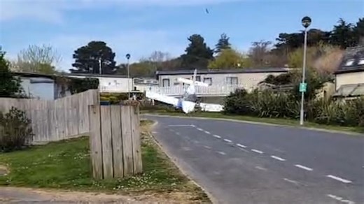 Shocking moment plane hit roofs and crash landed in Isle of Wight holiday park