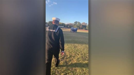 Sibling reunion during football huddle features surprise visit from Navy brother
