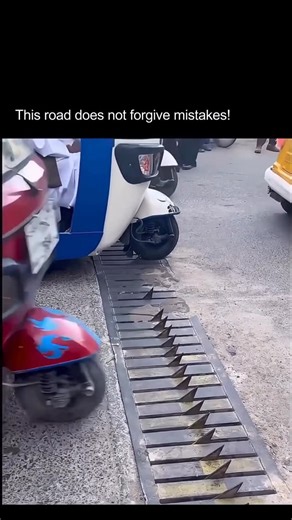 AI News | Tech | Human Impact on Instagram: "Some road designs whisper, others warn… But this one? It punishes you instantly. In this clip, Iran’s one-way traffic spike system shows exactly why some countries take road discipline so seriously. These spikes aren’t random pieces of metal they’re a mechanical enforcement system built to stop drivers from going the wrong direction, whether by mistake or on purpose. Here’s how it works: When you’re moving in the correct lane, the metal teeth fold fla