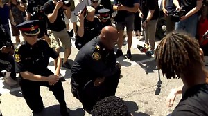 George Floyd protests: Police chief Mark Saunders takes a knee during Toronto rally
