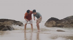Free stock video - Couple picking shells at the shore