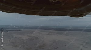 Giant flying saucer landing in the desert. UFO, UAP. High quality cinematic sci-fi film video footage. Alien spaceship. Vintage science-fiction. Alien invasion concept. Part 1 of 3.