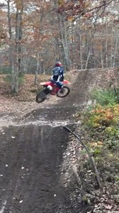 This guy attempting a dirt bike trick failed miserably. He speedily rode the bike uphill and jumped off a dirt ramp to perform the trick. Sadly, he lost balance upon landing and fell off the bike. | Jukin Copyright Management | Facebook
