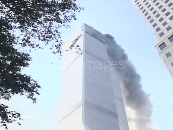 Tilt up view of the smoldering Twin Towers in New York on September...