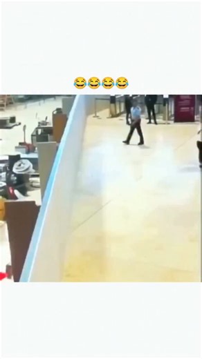 Zimvra on Instagram: "This viral 13-second clip captures a man leaping over an airport security barrier in a construction-zone terminal, pursued by uniformed guards amid purple partitions and storage boxes, edited with the "Bad Boys" Cops theme for comedic effect. Shared by @monitoring_feed , a news footage aggregator, the post exploded to 420,000 views within hours on January 21, 2026, tapping into audiences' fascination with real-time security fails and chase humor. While the exact airport rem