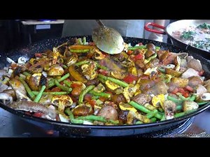 Cooking Spanish Paella with Vegetables and Mushrooms. London Street Food