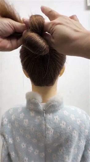 "Quick & Stylish Low Bun Tutorial! 💁‍♀️✨ Perfect for any day out. #Shorts #Hairstyle #DIY"