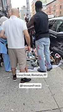 Exploring Canal Street, NYC’s famous hub for street shopping and well-known replica culture.
