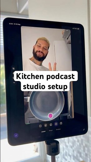 Kitchen podcast studio setup with iPhone and iPad