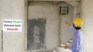 Factory reopen notice or signage with people busy working in background after COVID-19 coronavirus pandemic - Concept of back to work or business after lockdown Stock Video