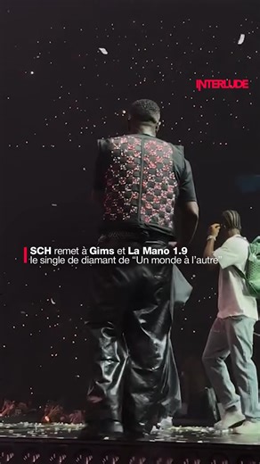 interlude on Instagram: "SCH a profité du concert de Gims à La Défense Arena pour lui remettre, à lui et à La Mano 1.9, le single de diamant du titre “Un monde à l'autre”, bande-son du GP Explorer 3 🎥 : @parisladefense_arena"