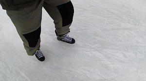 Top view from the first person man skating in winter