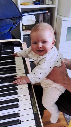 Baby plays piano for the first time