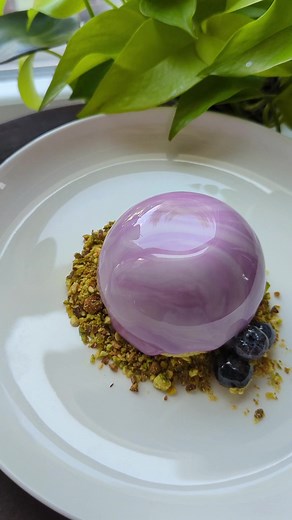 Levi eats mirror glazed blueberry mousse cake with crushed pistachios!#blueberries #moussecake #cooking #toddlereats #eatlikelevi