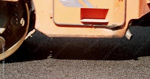 Road Paving on Residential Street. Asphalt laying. Road building asphalt paver is laying a new layer of asphalt, Road rollers drive on a new road. Roadway repair. Heavy machinery. Stock Video
