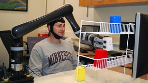 Succeeded to three-dimensionally move the robot arm as desired by wearing a hat with an electrode