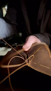 The baseball stitch! Another boot build starting out here and the first stitch is always the fun one. Here we are sewing up the spine of the boot at the heel. Pulling the two curved patterns together with this kind of stitch is where the rounded profile of the back of the boot is born. #asmr #leathercraft #leatherwork #handmadeboots #handsewing #handstitched | Bob Henderson