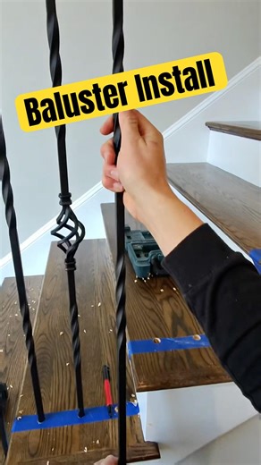 Installing wrought iron balusters to this staircase remodel. #AMGfinishes #staircase #baluster