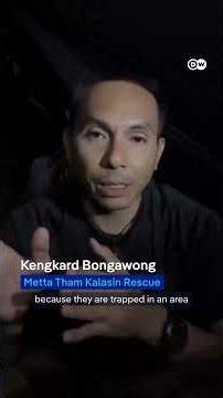 Divers race to rescue villagers trapped in flooded Laos cave | DW News