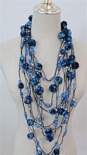 Multi-strand bead necklace made from handmade textile beads. A video on how to assemble them will...