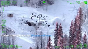 Alaska man rescued after carving giant SOS message in the snow