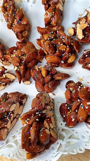 Matthew Cutolo on Instagram: "My great grandmother’s almond candy — always on our table at Christmas! 🎄🍬 This old-school Italian almond torrone is one of those holiday traditions that brings you right back. Simple ingredients, all about timing, and made the same way it’s been for generations. Watching the sugar turn that deep amber color is part of the ritual — a recipe you learn by feel, passed down from one holiday season to the next. This is how Christmas has always looked in our kitchen. �