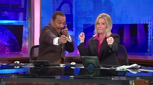 WGN-TV Anchors Robert Jordan and Jackie Bange`s commercial break handshake