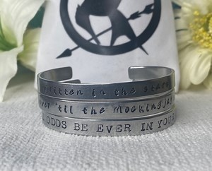 The Hunger Games Handstamped Cuff Bracelet - Ballad of Songbirds and Snakes - Lucy Baird - Mockingjay - Sunrise on the Reaping - Etsy