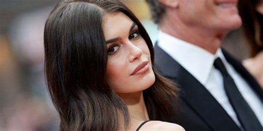 Kaia Gerber Poses Topless Wearing Nothing but a Cardigan Wrapped Around Her Neck