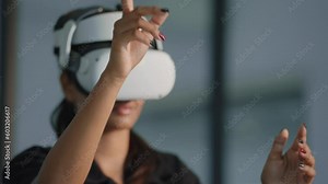 Close up businesswomen executive using virtual reality headset in office. Woman testing VR goggles or glasses for working virtual project .VR technology and business concept