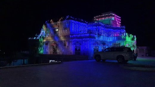 Vibrant Multicolored LED Lights Decorate Historic Building