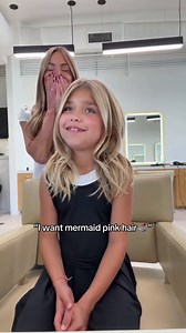 Little girl gets clip-in mermaid pink hair extensions