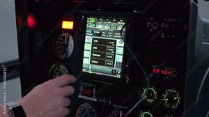 CLOSE UP: A helicopter pilot manipulates the helicopter flight controls to achieve and maintain controlled aerodynamic flight. Pilot adjusting the settings to take off in a chopper and start a journey