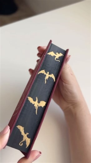 Sydney on Instagram: "Rebinding Fire and Blood (prequel to Game of Thrones), the book that inspired House of The Dragon 🐉 There’s a surprise at the end, I attempted painted edges for the first time and it ties the whole look together perfectly!! I’ve been binging season 1 all weekend while working on this rebind, to prep for the premiere tonight and I’m catching so many details on this rewatch! 🖤 TEAM BLACK over here, what about you? ___ special edition books, paperback to hardcover, DIY book