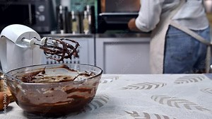 Process of cooking delicious homemade cake. Woman preparing and mixing ingredients for sweet food dessert in kitchen at home.