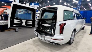 New model white '23 MK Coach Company XT6 Grand Legacy walk around at National Funeral Directors Association Las Vegas convention. Note this is prototype and production models with optional smart glass will have activation located by strobe switch, not remote. #funetorium #funeralfinds #funeralhistory #funeralcoach #coachbuilt #mkcoach #cadillac #xt6 #grand #legacy #hearse #procar #nfda #lasvegas | Funetorium