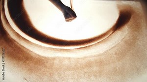 Drawing with sand. Drawing sand on a white screen. Sand Artist. Hands draws