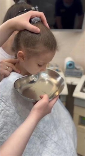 Vacuum lavage of the nasal sinuses of a child while sitting