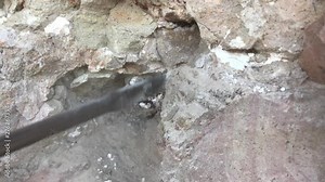 Using a rotary hammer and spade bit to mine for rare rocks