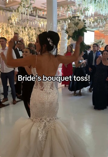 Exciting Moments: Bride's Bouquet Toss at Wedding