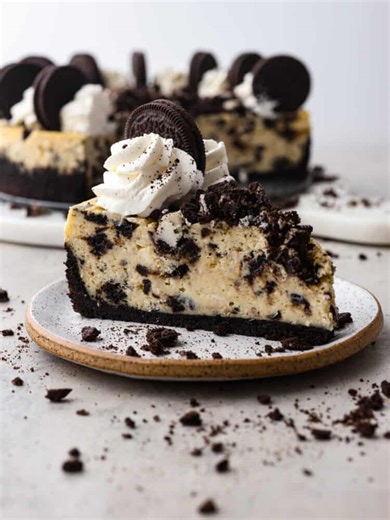 Recipe here: https://therecipecritic.com/oreo-cheesecake/ Silky and smooth with the perfect bite-sized oreo bits in every single slice, you won’t be able to stop raving about this cheesecake! | Tried and True Recipes