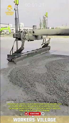 An operator controls an automatic road paving machine that is pouring and leveling concrete