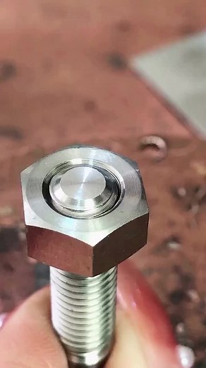 Engraving a Hexagonal Metal Piece in Close-Up
