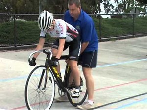 Track racing handler holding technique
