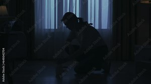 Everyday life housekeeping concept. Woman in casual clothing washing the floor with brush in the living room.