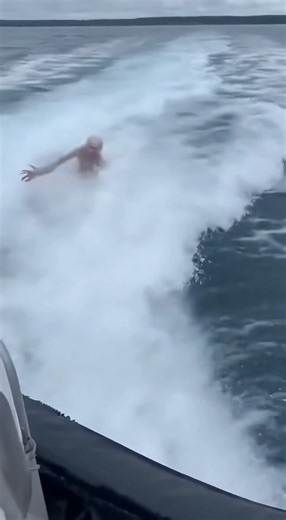 Pale Humanoid Surges Up in Boat Wake Before Being Dragged Under