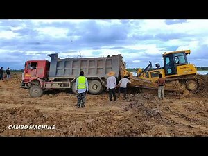 Incredible! Heavy Dump truck stuck in deep mud during pouring soil Recovery byStronger Dozer SHANTUI