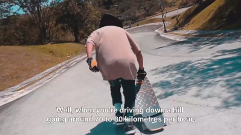 This young man masters downhill skateboarding