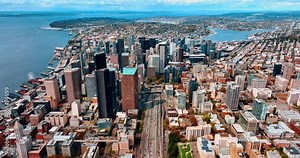 Sunny panorama of beautiful Seattle, Washington, the USA. Skyscrapers in the city downtown surrounded by low-rise architecture. Top view. Stock Video