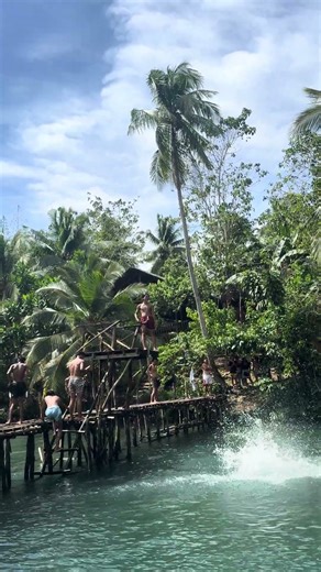 Jumping Off a Platform at Beto Cold Spring in Siargao, Philippines